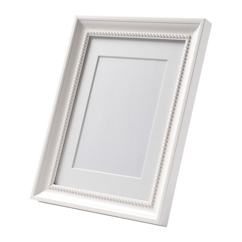 SÖNDRUM Cadre IKEA Le passe-partout fait ressortir la photo et rend l'encadrement plus facile. 
