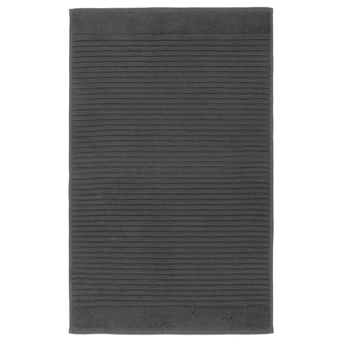 Dark grey rectangular ALSTERN bath mat, pure cotton terry, massaging texture.