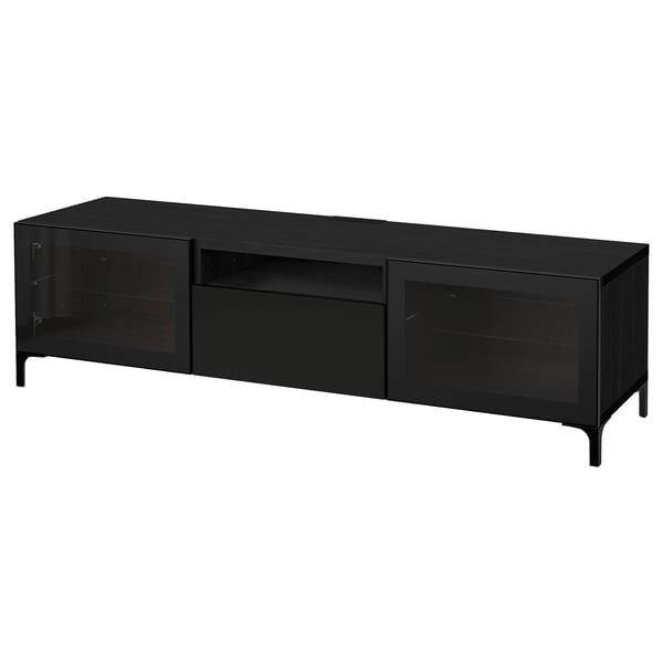 A black BESTÅ tv bench with glass doors and metal legs, offering storage and cable management.