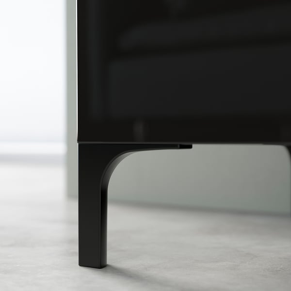 Black BESTÅ tv bench with sleek, curved metal legs.