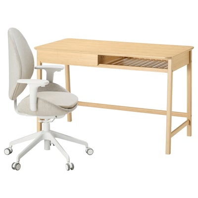 A light-colored wooden desk with a built-in drawer and a matching ergonomic office chair in white and upholstered fabric are paired together.
