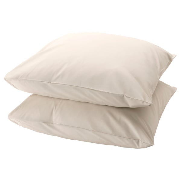 Two square beige pillows, stacked, smooth fabric, simple design.