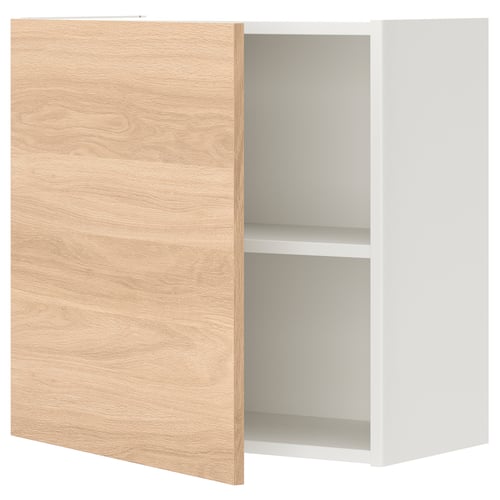 An open ENHET wall cabinet with an oak-effect door, displaying a single white shelf inside.