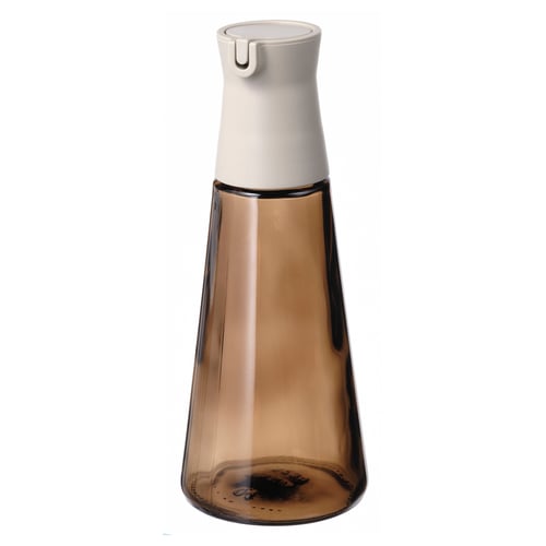 HALVTOM amber glass oil dispenser with white pour spout, slim conical shape, stylish kitchen tool.