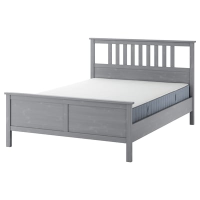 Grey HEMNES wooden bed with white mattress, sleek design, clean lines.