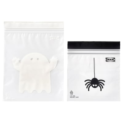 Two IKEA zip bags, one with a ghost image, one with a spider image, white with black accents.