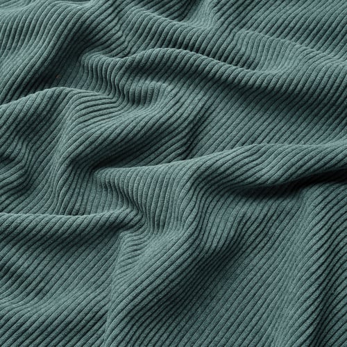 Teal corduroy fabric close-up, showcasing thick, ridged texture and soft, comfy feel.