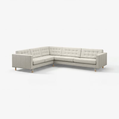Light grey modern corner sofa with tufted cushions and wooden legs.