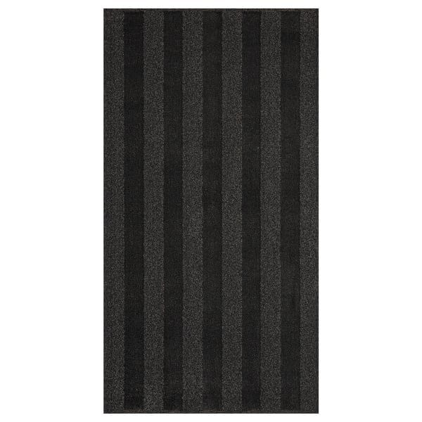 Black and grey striped rug, rectangular, soft, low pile, bedside rug.