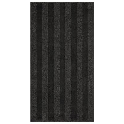 Black and grey striped rug, rectangular, soft, low pile, bedside rug.