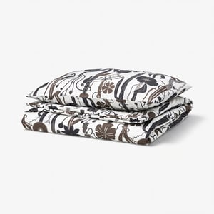 Folded LUNDSKAFTING duvet set, white with wild brown botanical patterns, rectangular shape.