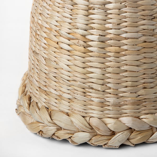 Hand-braided lampshade with natural banana fibres, showcasing intricate weave and soft, warm glow.