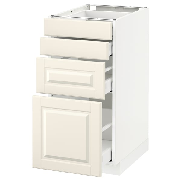 White METOD kitchen cabinet with three drawers and door, off-white fronts, bevelled edges.