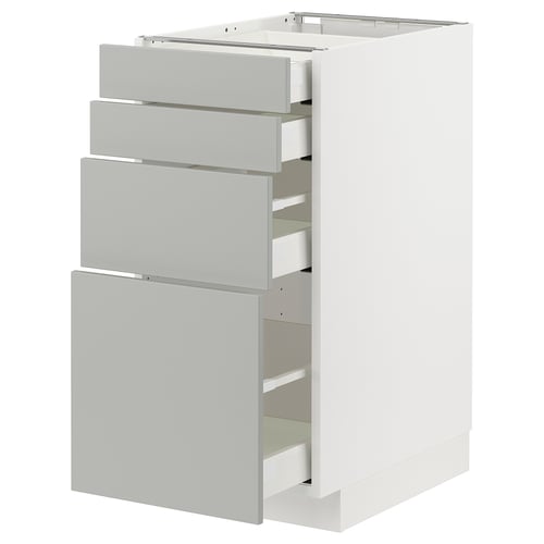 A white and light grey modern kitchen unit with multiple drawers.
