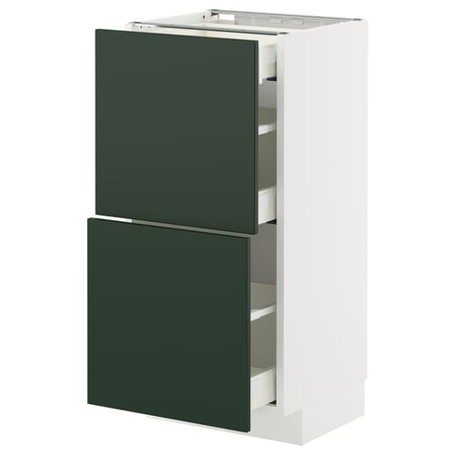 A METOD kitchen cabinet with green havstorp fronts, white frame, and pull-out drawers.
