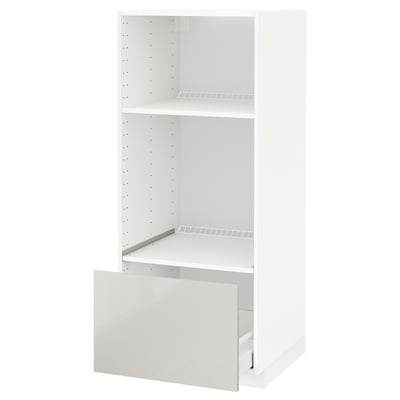 White METOD kitchen cabinet, glossy finish, open drawer, adjustable shelf.