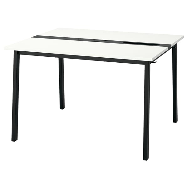 A modern MITTZON desk. It a white top and dark legs. The design is minimalist and functional.