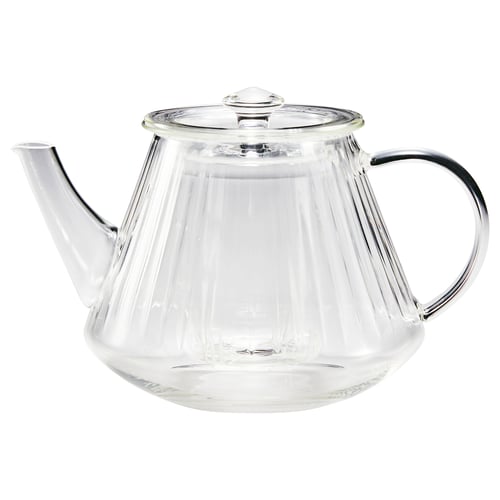 A glass teapot SKÄLRYTA with flute design, infuser, and lid. Heat-resistant with comfortable handle.