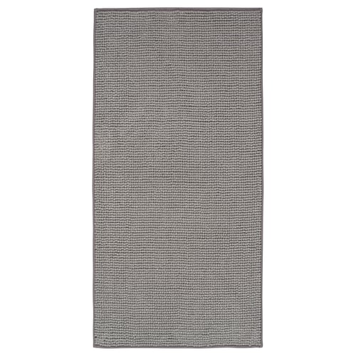 A TOFTBO grey bath mat. It a textured, rectangular design made from recycled polyester materials.