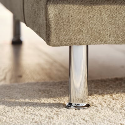 Modern sofa with sleek chrome legs, offering comfort and contemporary style.