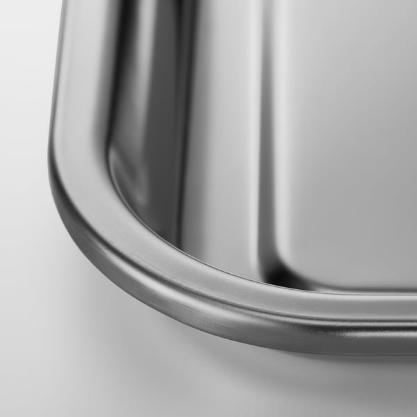 Close-up of sleek, high-quality stainless steel baking sheet edge.