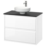 Moderner weißer Wandwaschtisch mit schwarzer Arbeitsplatte und rundem Waschbecken, schlankes Design.