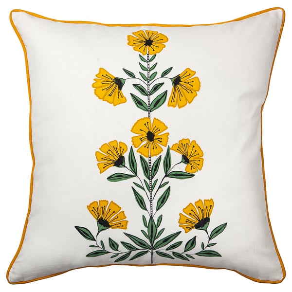 Dekoratives quadratisches Dekokissen namens AROMATISK mit gelbem Blumenmuster auf weißer Baumwolle, eingefasst von gelben Paspeln.