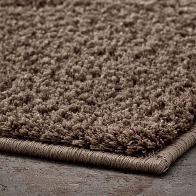 Beige BACKMÅRA Badematte mit U-Cut, weichem Griff aus recyceltem Polyester, Latexgriff.