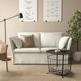 Minimalistisches Wohnzimmer mit BACKSÄLEN Sofa, Couchtisch und Wandkunst.