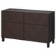 Dunkelbraunes Sideboard aus Holz mit vier Türen und passenden Griffen.