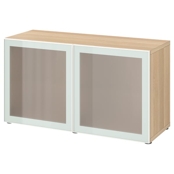 BESTÅ Holzschrank mit Milchglastüren, hellbeige, rechteckig.