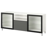 Eine IKEA BESTÅ TV-Bank in Weiß mit schwarzen Akzenten und geriffelten Glastüren.