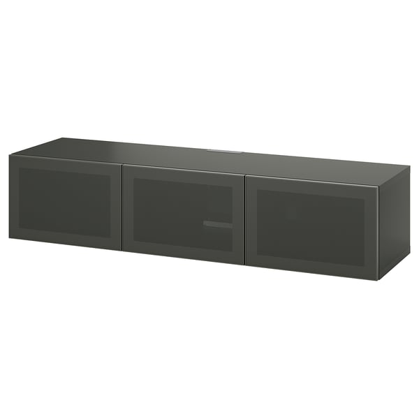 Eine IKEA BESTÅ TV-Bank in Dunkelgrau. Er verfügt über drei Netztüren für das Kabelmanagement und verstellbare Regale.