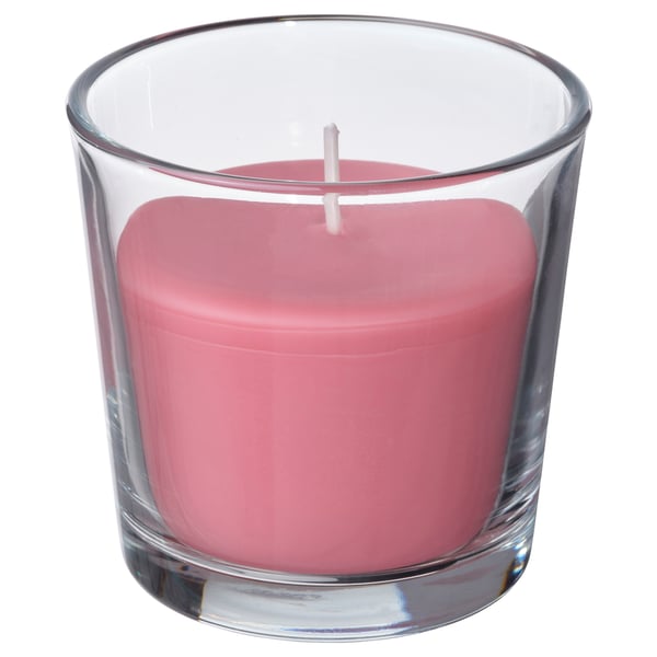Rosa Duftkerze aus klarem Glas, zylindrische Form mit glatten Kanten.