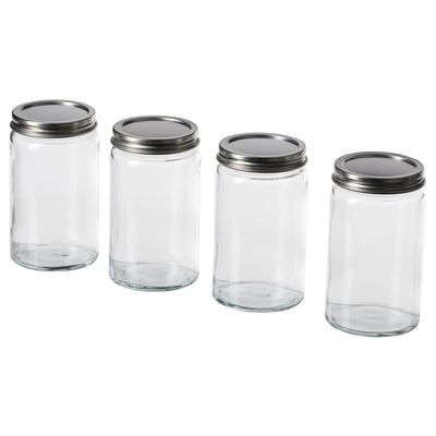 Vier leere Gläser mit silbernen Deckeln aufgereiht. Klares, minimalistisches Design. Perfekt zum Aufbewahren von Gewürzen oder anderen Küchenutensilien.