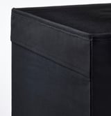 Nahaufnahme einer robusten, gut genähten Aufbewahrungsbox aus schwarzem Stoff; zeigt Qualität und Design.