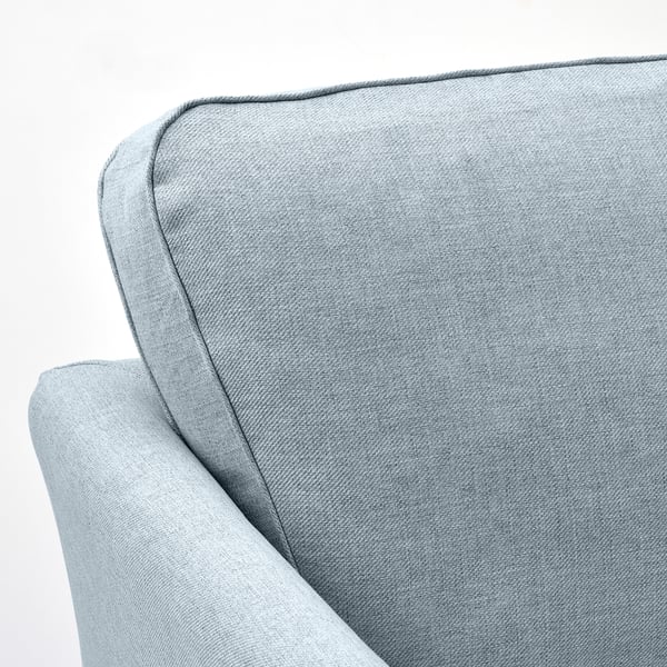 Plüschstrukturiertes Sofa mit schlanken Linien und robuster Konstruktion.