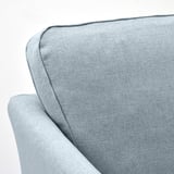 Plüschstrukturiertes Sofa mit schlanken Linien und robuster Konstruktion.