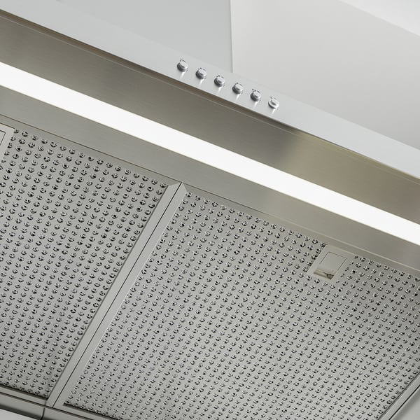 Moderne Edelstahlhaube mit LED-Leuchten. Ausgestattet mit Fettfiltern und integriertem Gewürzregal.