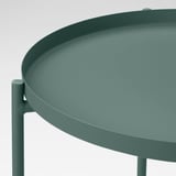 Moderner, grüner runder Tabletttisch mit glatter Oberfläche und robusten Beinen für Stabilität; Ideal zum Servieren und leicht zu bewegen.