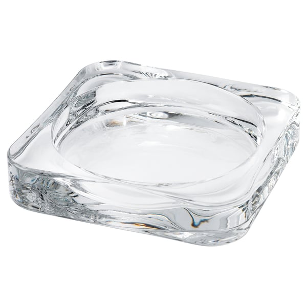 Kleine, klare quadratische Kerzenschale aus Glas, gewellte Ränder.