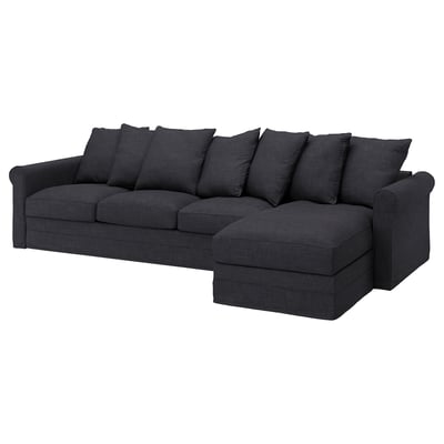 Dunkelgraues, tiefer Sitz, L-förmiges Sofa mit weichen Kissen.