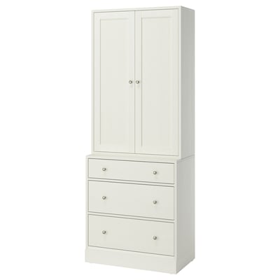 Dieses Bild zeigt einen hohen weißen Schrank von HAVSTA mit Schubladen. Es hat ein klares, modernes Design aus Kiefer und Faserplatten.