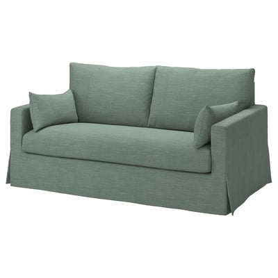 Grünes HYLTARP-Schlafsofa. Weich, bequem. Sauberes Design. Wendbare Kissen. Leicht zu reinigen, verwandelt sich in ein Bett.