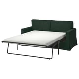 Grünes HYLTARP-Schlafsofa, modernes Design, mit Metallbeinen und weißer Matratze, teilweise ausziehbar.