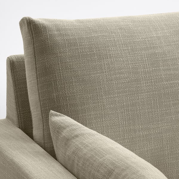 Moderner Couchbereich mit hochwertigem, strukturiertem grauem Stoff. Bequeme, klare Linien, wendbare Kissen.