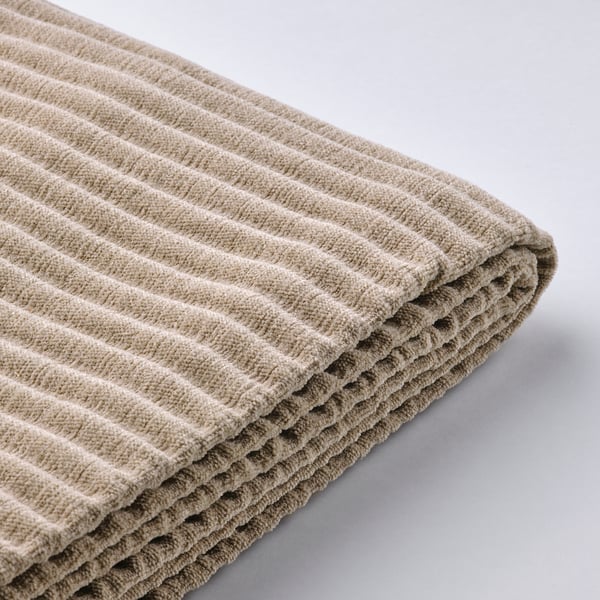 Gefaltetes Sofa aus beigem Stoff mit gestreifter Textur. Weich, einladend und gemütlich und zeigt hochwertige Handwerkskunst.