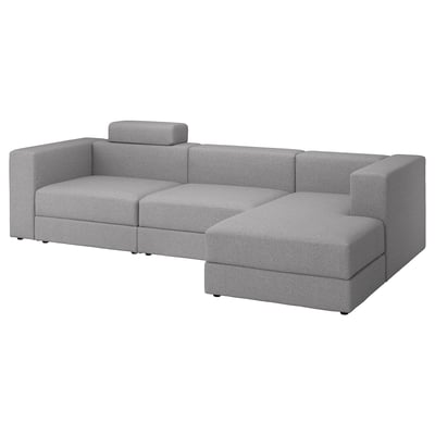 Modernes graues L-förmiges Sofa, schlankes Design, mittelfeste Kissen und funktionaler Stauraum.