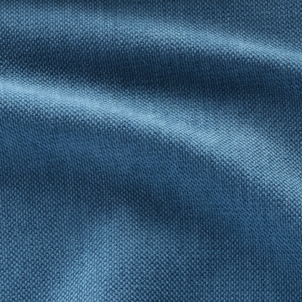 Nahaufnahme aus weichem, strukturiertem blauem Stoff. Luxuriöses, gewebtes Muster suggeriert hochwertiges, bequemes Material.