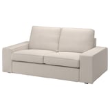Ein KIVIK-Sofa, cremefarben, mit einem Bezug aus strukturiertem Stoff. Er hat ein weiches, abgerundetes Design mit zwei Kissen und Armlehnen.
